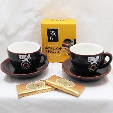 Cappuccino cup gift with two Maxwell Williams dark brown cappuccino cup and saucers, Molly Woppy biscotti and chocolate